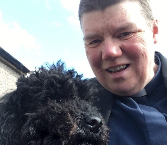 Rev. Mary Whittaker with her dog