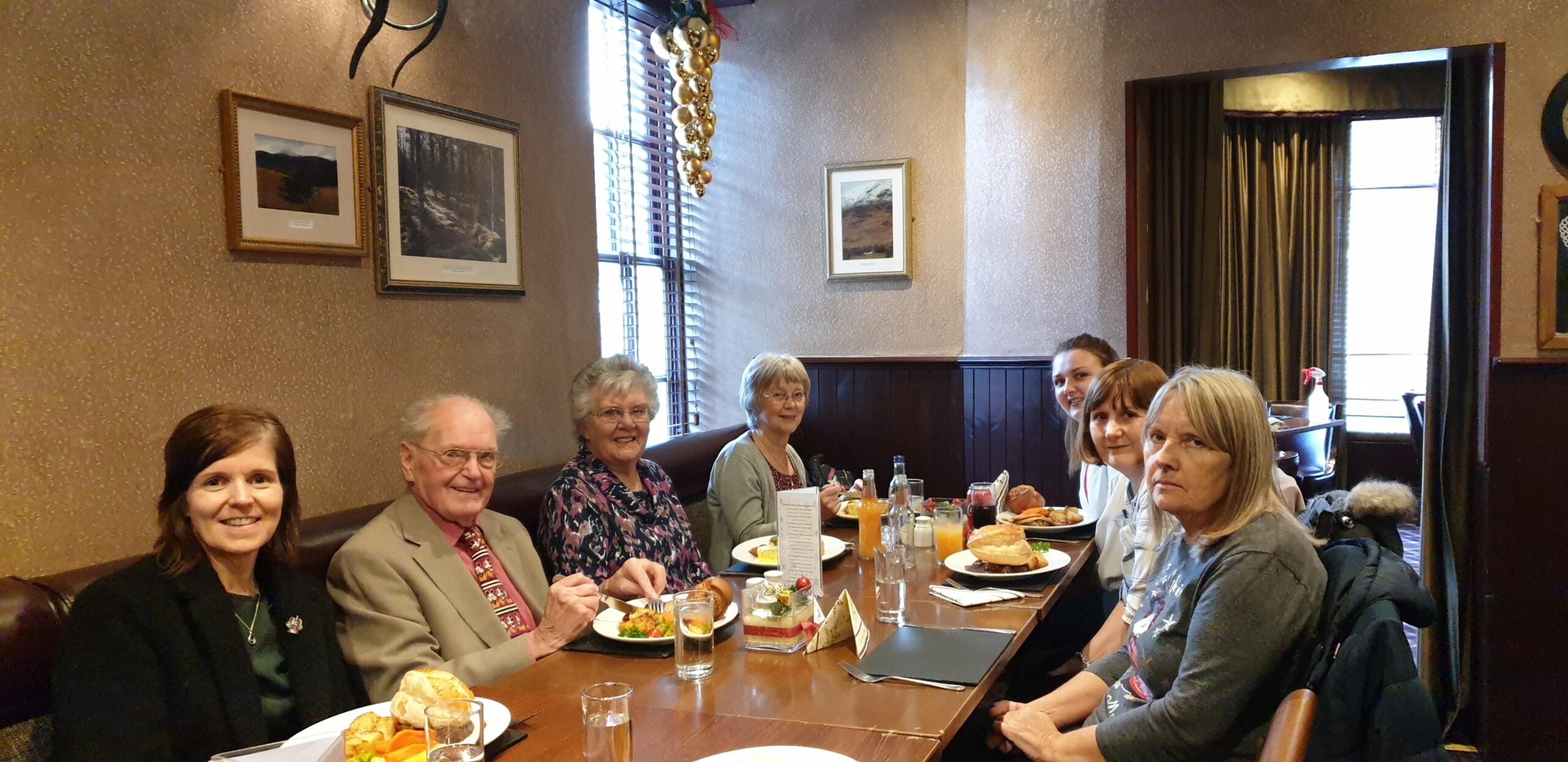 People enjoying a festive Xmas lunch