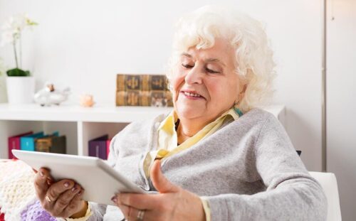 Elderly woman viewing her iPad