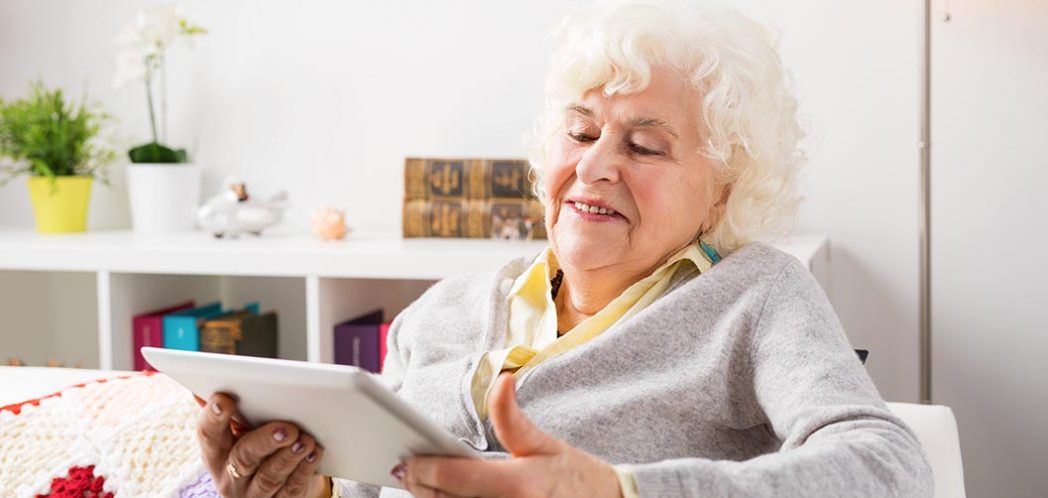 Elderly woman viewing her iPad