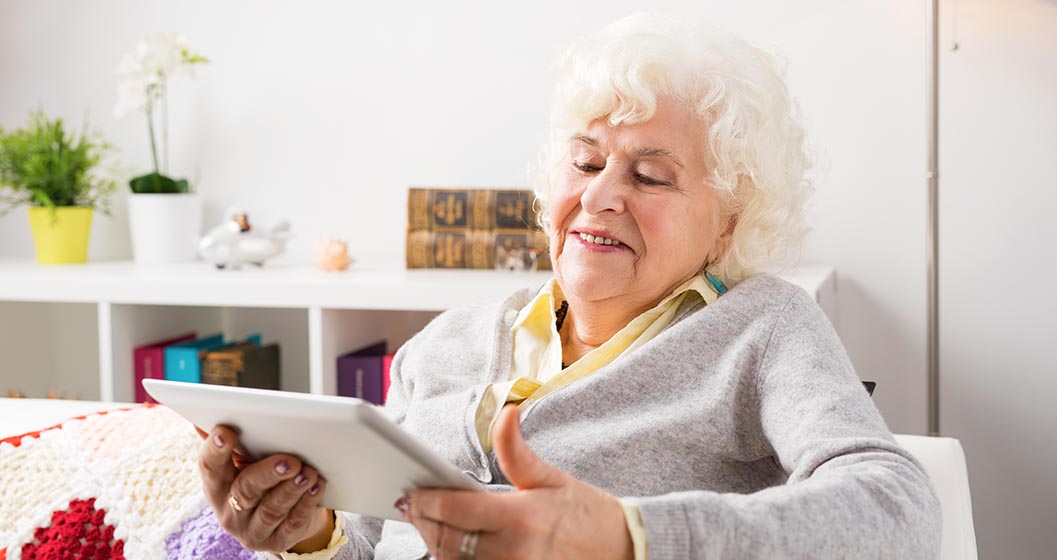 Elderly woman viewing her iPad