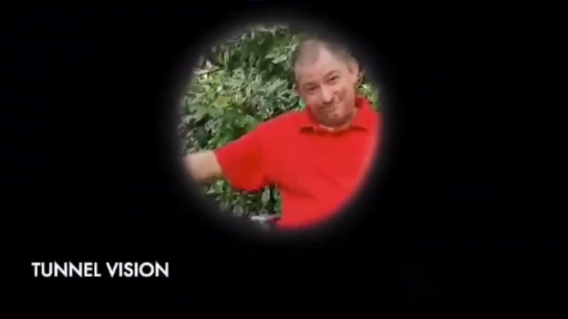 Image of a man in a red shirt. A small circle is visible. The image illustrates Tunnel Vision