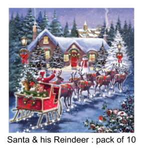 Santa and his Reindeer in front of a festive landscape with a light up cottage behind