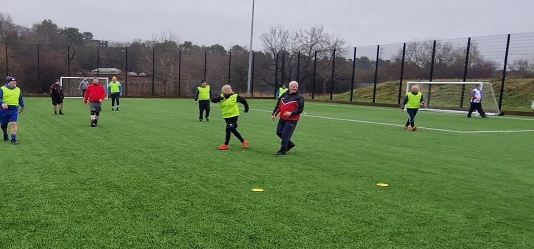 A group of people play walking football